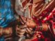 dowry system, Woman putting bangles on bride